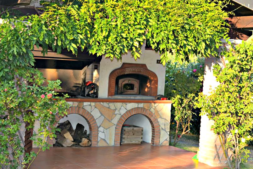 tuscan villa outside pizza oven