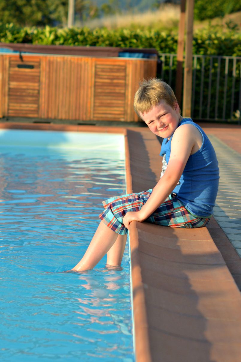 jasper by the villa pool in tuscany