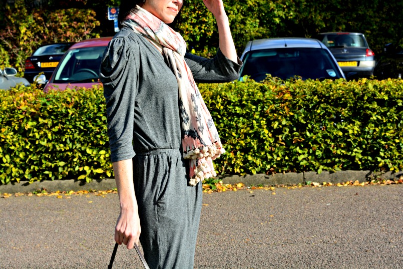 Sandro grey jumpsuit | Prada zebra pony hair bag | Whistles white two part sandal | All Saints Ikat pom pom scarf