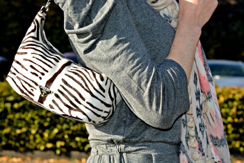 Sandro grey jumpsuit | Prada zebra pony hair bag | Whistles white two part sandal | All Saints Ikat pom pom scarf