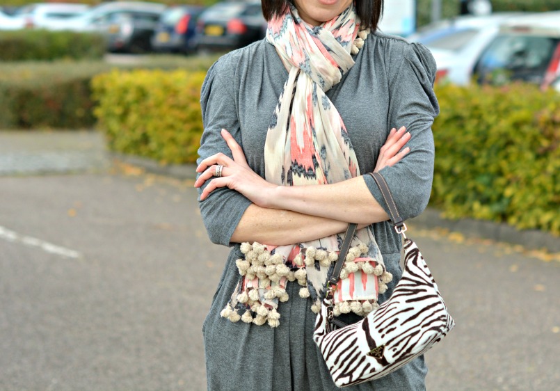 Sandro grey jumpsuit | Prada zebra pony hair bag | Whistles white two part sandal | All Saints Ikat pom pom scarf