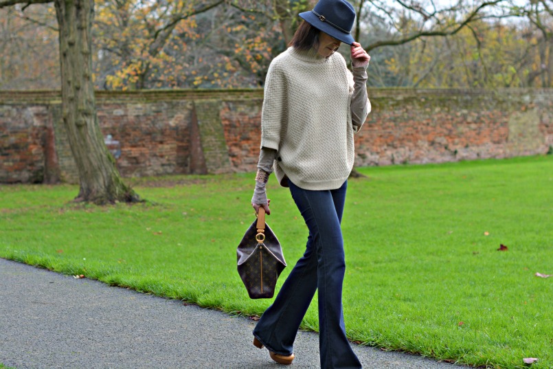 Laura Ashley poncho | Laura Ashley blue fedora | J Brand jeans flares | Louis Vuitton sully bag | Marc by Marc Jacobs tan wedge heel shoes