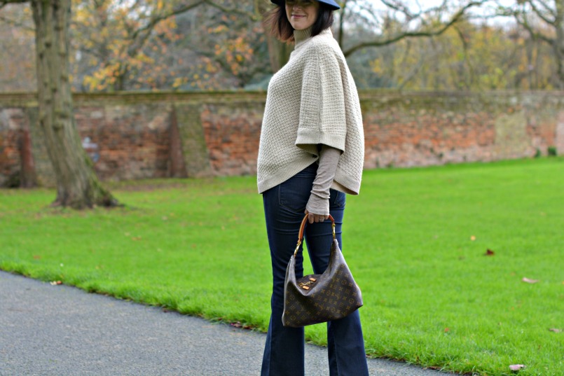 Laura Ashley poncho | Laura Ashley blue fedora | J Brand jeans flares | Louis Vuitton sully bag | Marc by Marc Jacobs tan wedge heel shoes