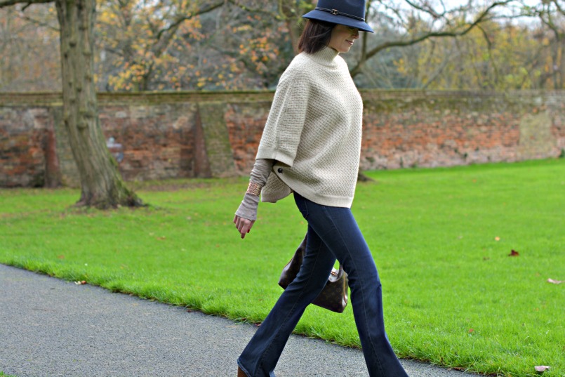 Laura Ashley poncho | Laura Ashley blue fedora | J Brand jeans flares | Louis Vuitton sully bag | Marc by Marc Jacobs tan wedge heel shoes