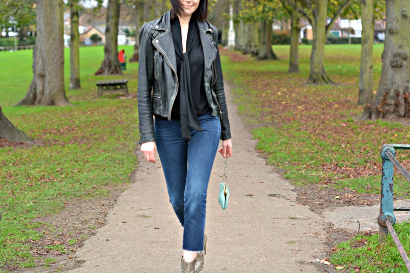 Allsaints Cargo leather biker jacket | J Brand cut off Bardot jeans | Allsaints snake skin ankle boots | Zara tie neck black knit top | Vintage accessorize blue small silk purse bag