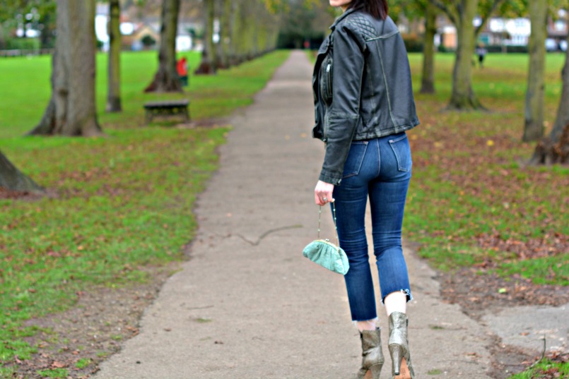 Allsaints Cargo leather biker jacket | J Brand cut off Bardot jeans | Allsaints snake skin ankle boots | Zara tie neck black knit top | Vintage accessorize blue small silk purse bag