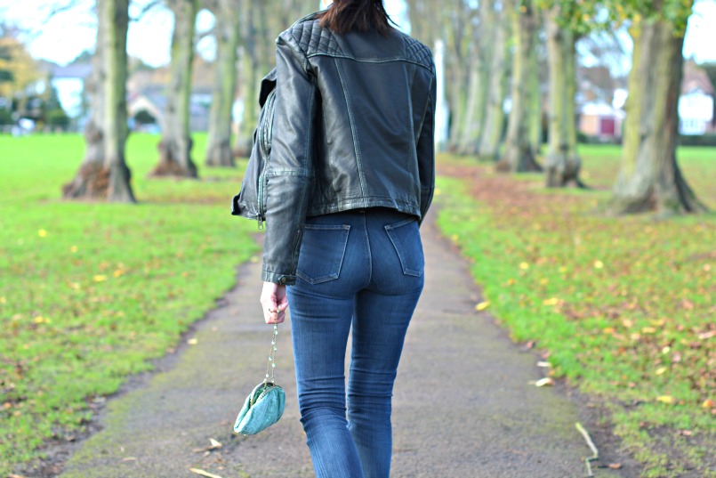 Allsaints Cargo leather biker jacket | J Brand cut off Bardot jeans | Allsaints snake skin ankle boots | Zara tie neck black knit top | Vintage accessorize blue small silk purse bag