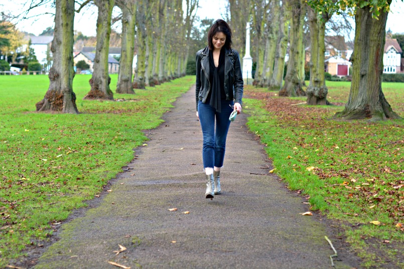 Allsaints Cargo leather biker jacket | J Brand cut off Bardot jeans | Allsaints snake skin ankle boots | Zara tie neck black knit top | Vintage accessorize blue small silk purse bag