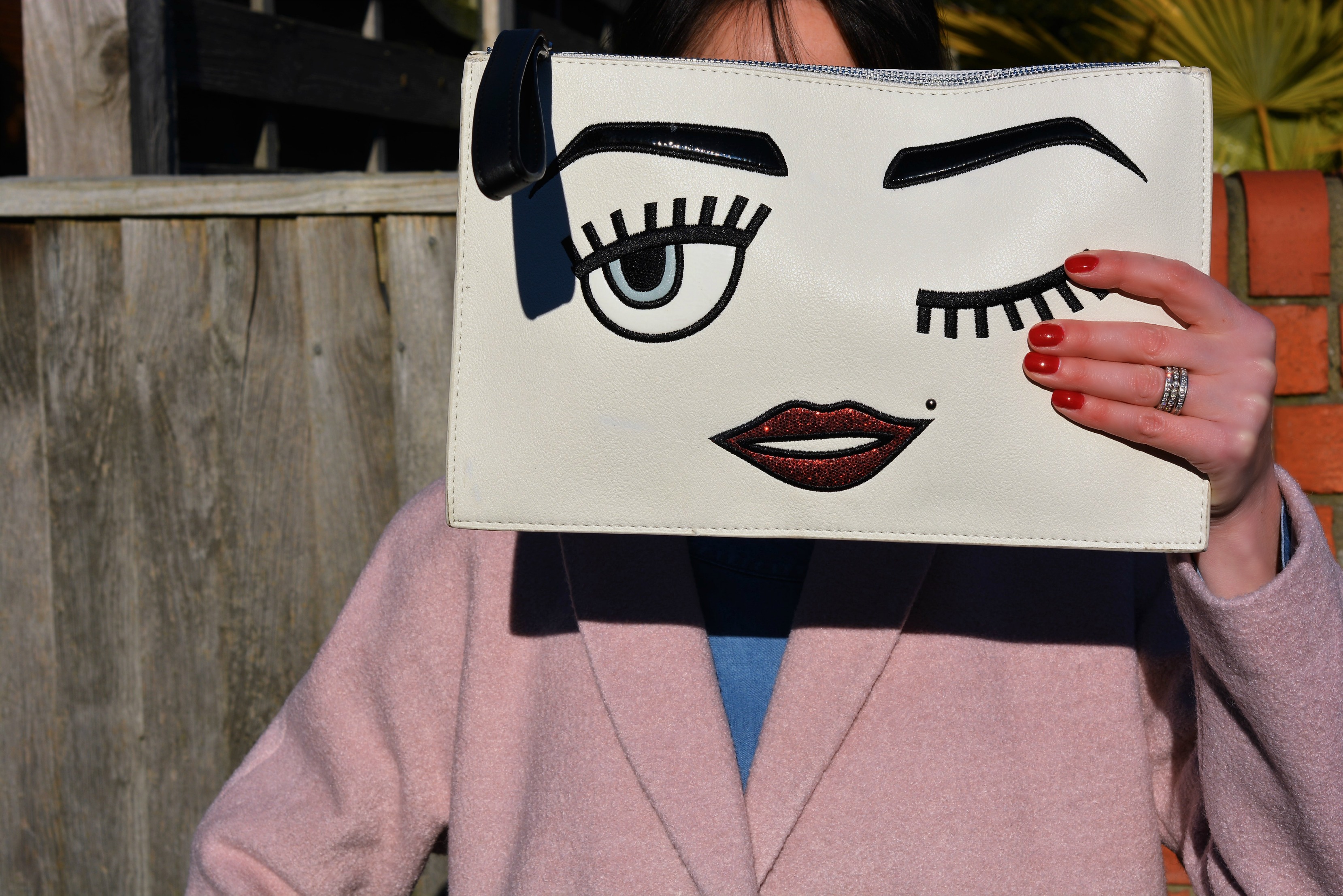 Cartoon face clutch bag from Tkmaxx