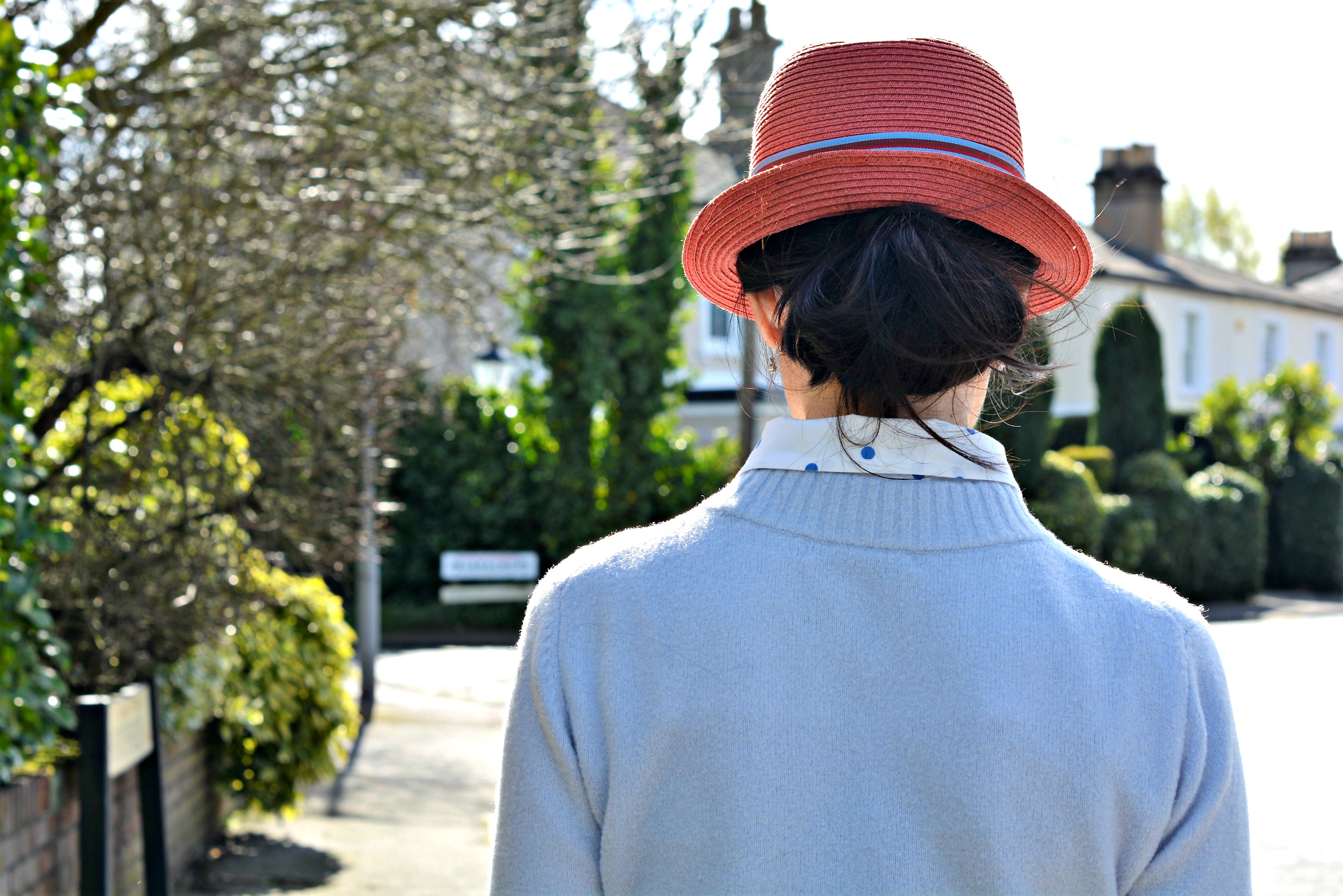 wear a low bun under your trilby chic over 40