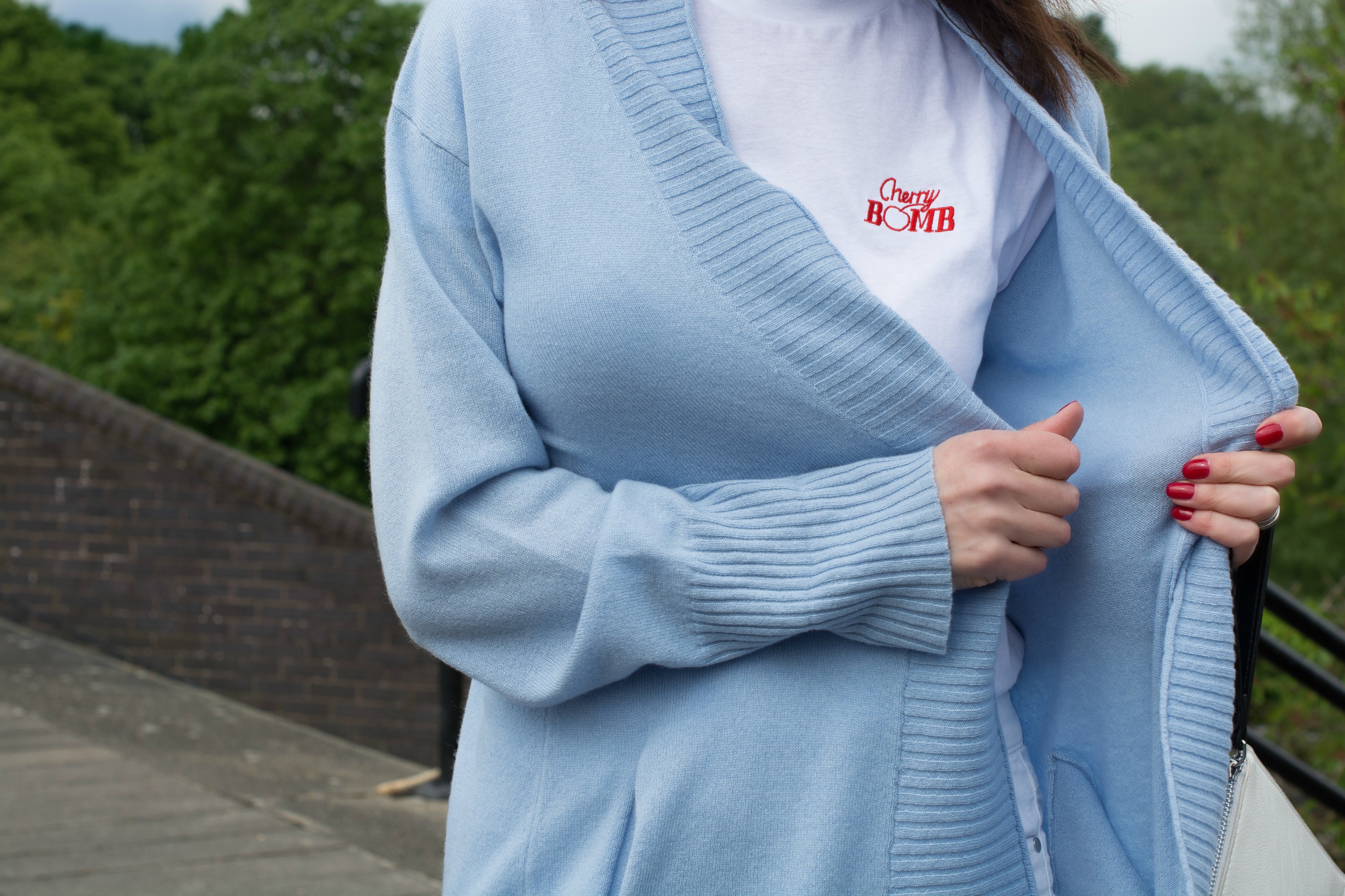 blue cashmere cardigan with white jeans and white t shirt