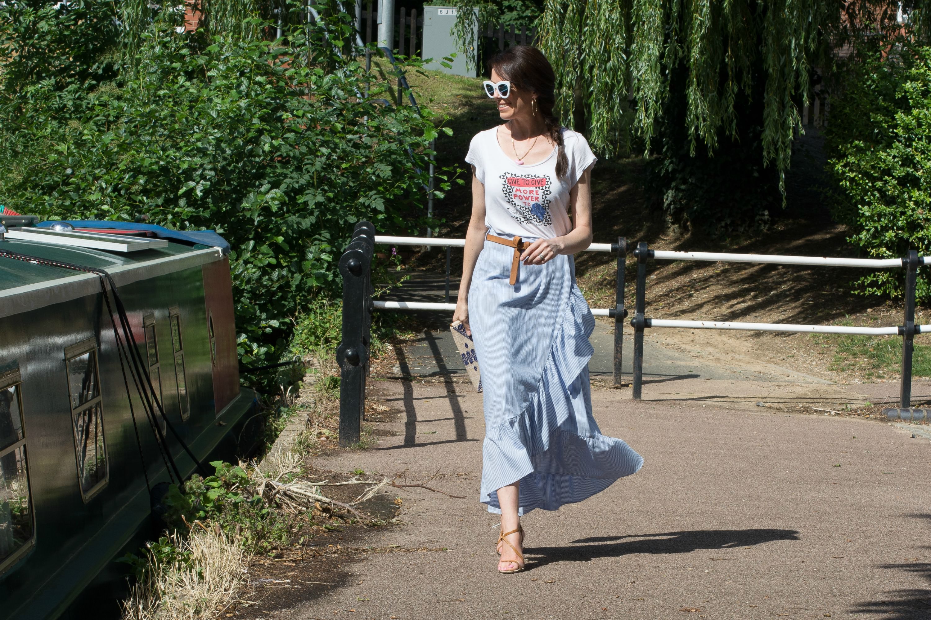 blue-pinstriped-cotton-skirt-raffia-clutch