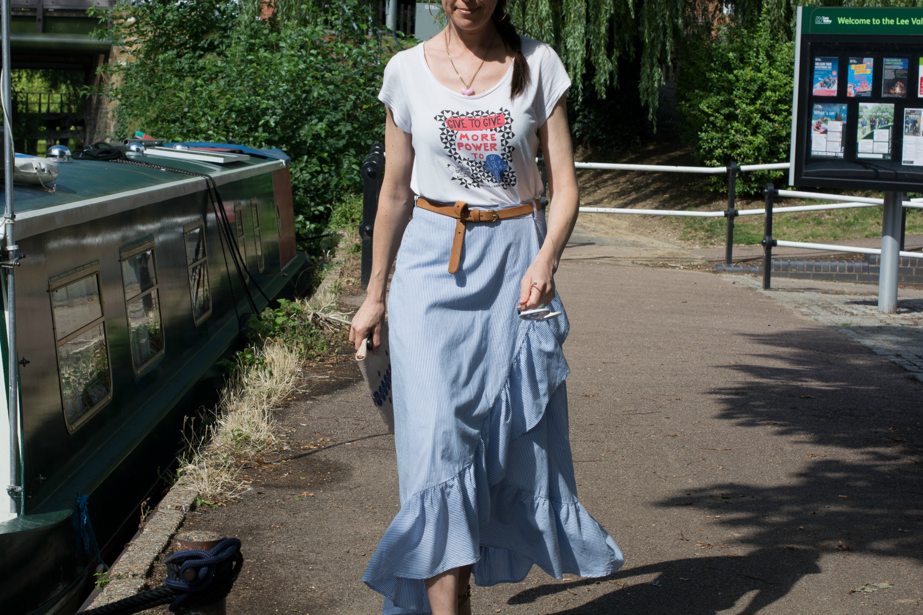 blue-pinstriped-cotton-skirt-raffia-clutch