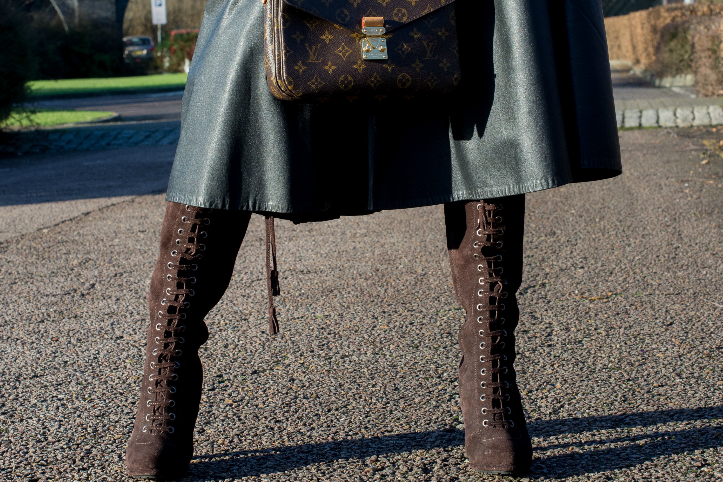 brown-suede-lace-up-boots-black-leather-full-circle-midi-skirt-louis-vuitton-metis