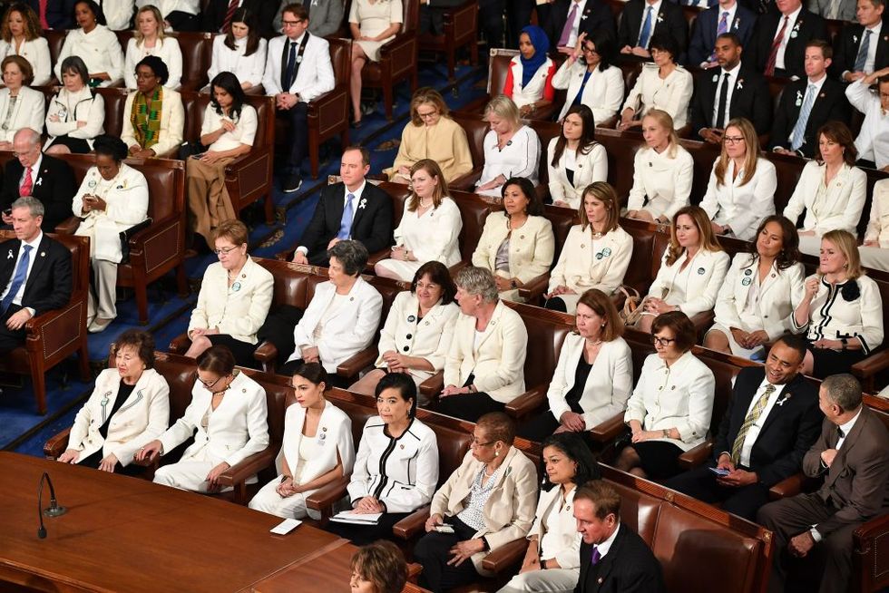 congresswomen wearing white suits in silent protest against trump policies